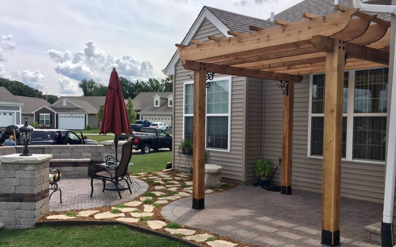 pergola in the backyard of a house