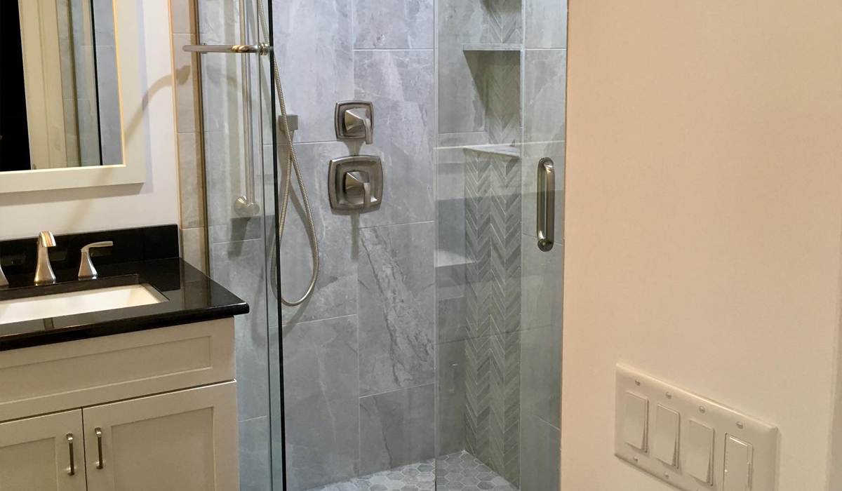 a shower room with glass doors