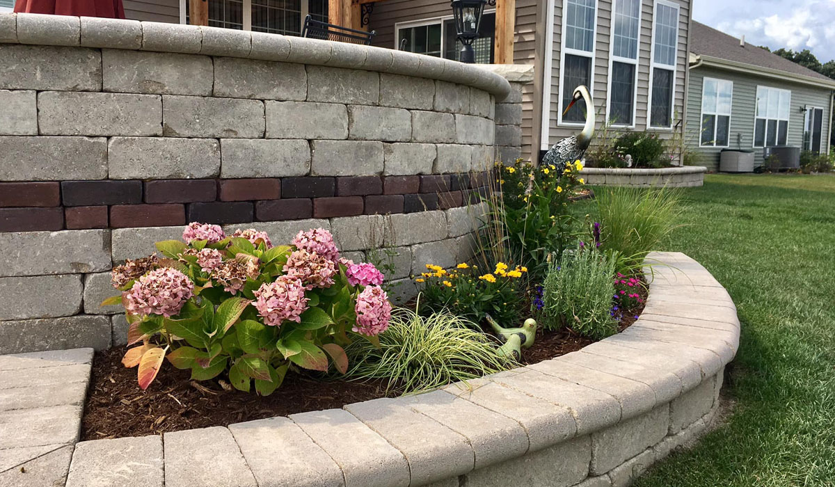 a small plant-filled retaining wall